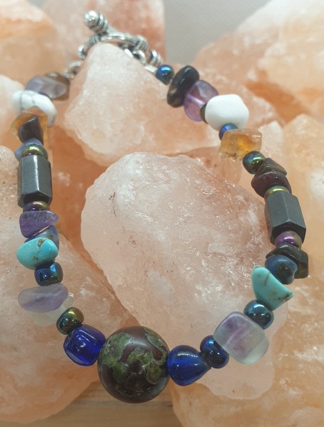 Dragon in the Gems Bracelet - Dragons Blood Jasper Bead surrounded by Fluorite, Blue & White Howlite, Hematite, Sugalite Chips with Assorted Beads and a Toggle Clasp